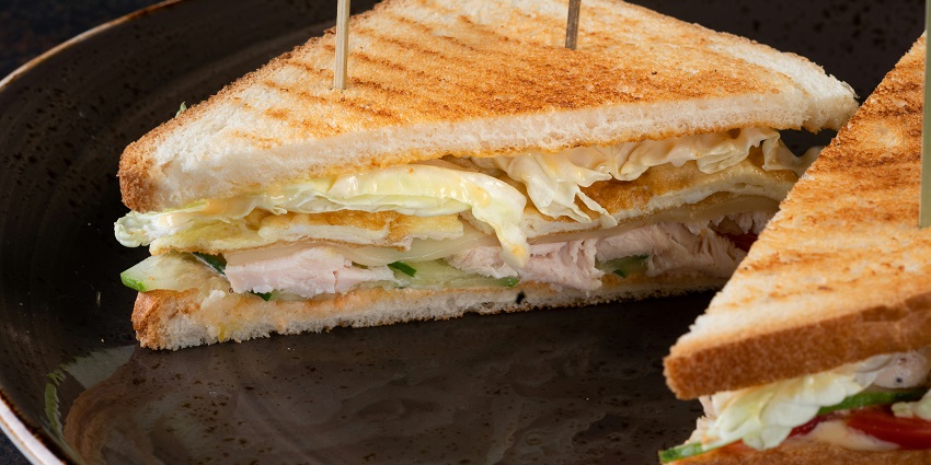 Chicken sandwich served with tea at Margaret’s Deck, one of the top restaurants in Kurseong.