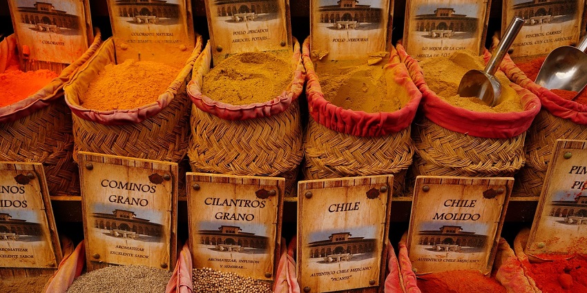 Various spices are displayed in sacks at Mattancherry Spice Market in Kerala.
