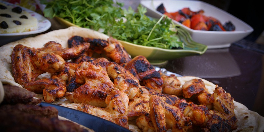 Close-up of grilled chicken served at Maxwell Food Centre, a highlight among restaurants in Chinatown.
