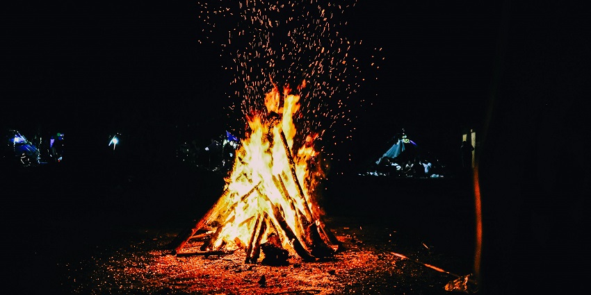 A glowing bonfire burning brightly at night during the Moatsu Festival in Nagaland.
