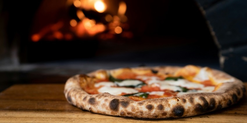 Wood-fired pizza served sizzling hot at Mocha Cafe & Bar.