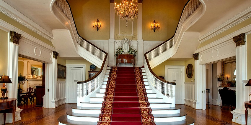 Spacious and welcoming lobby of Mysuru Hotel Galas with elegant décor and seating.
