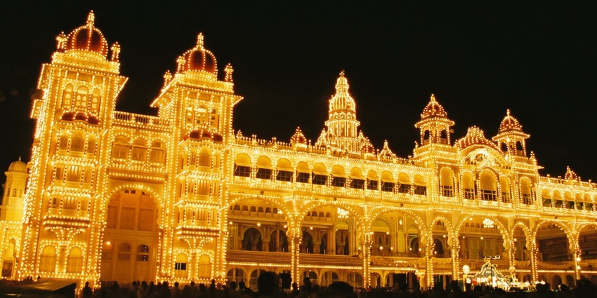 An intricately lit-up Mysore Palace at night, during the famous Dasara Navratri celebrations, one of the best Navratri in India.