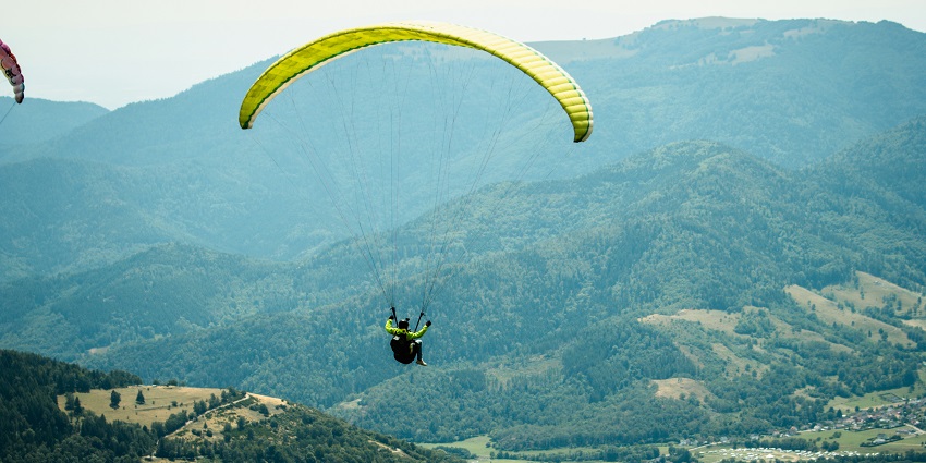 Paragliding in Karnataka at Nandi Hills with stunning cloud views and scenic landscapes.