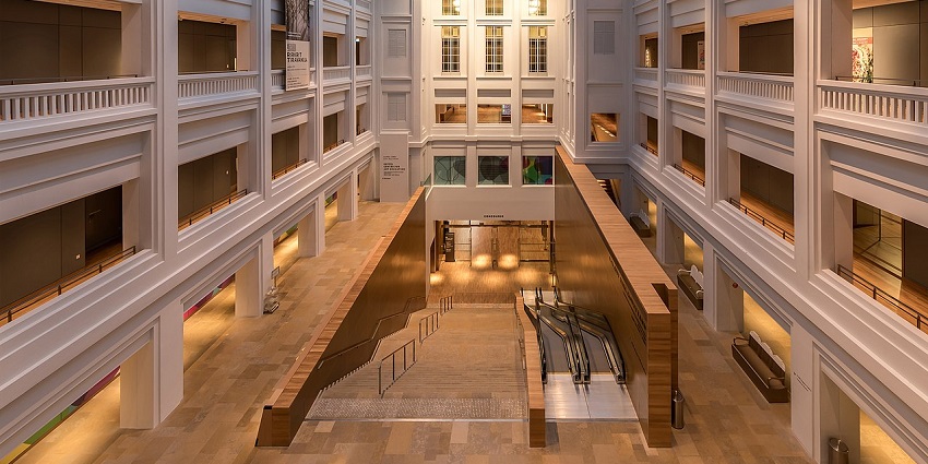 The inside view of the National Gallery Singapore with open atrium and natural light.