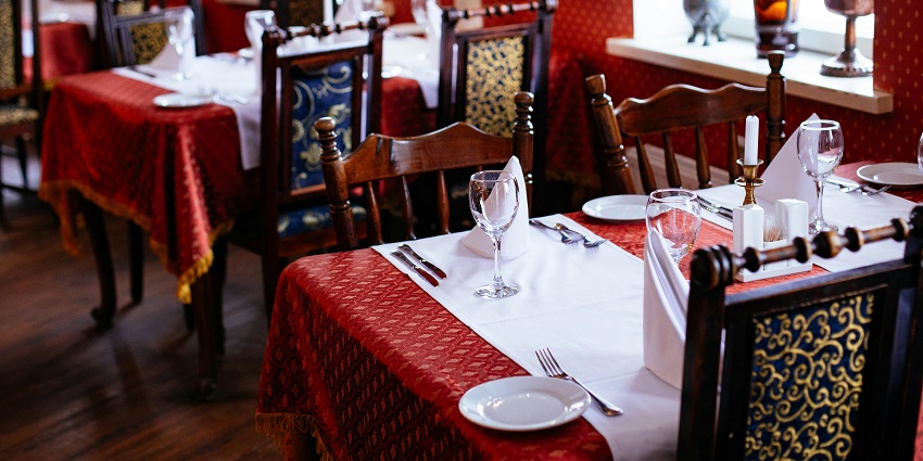 Interior of New Lighthouse Restaurant with fine dining tables and chairs, one of the famous restaurants in Port Blair.