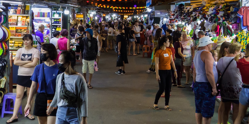 Nha Trang Night Market lively with stalls and lights, a must-visit for shopping in Vietnam.

