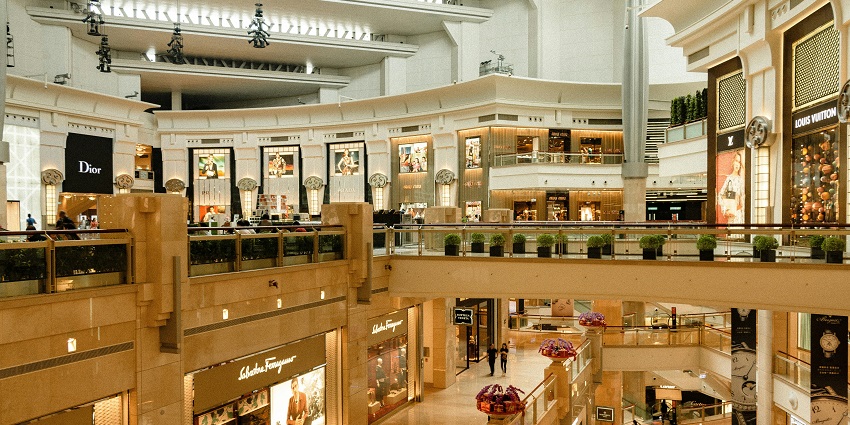 Interior view of Pacific Place mall with multiple stores and shoppers inside.