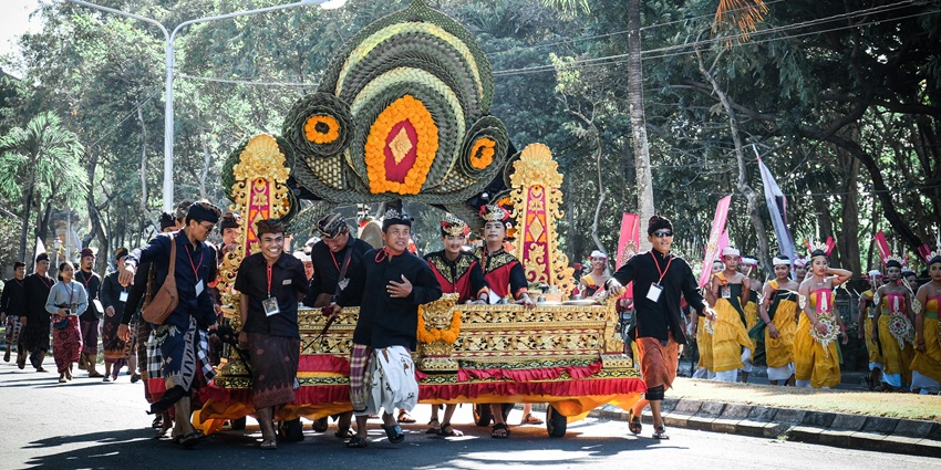 Pagerwesi festival parade with Balinese people celebrating festivals in Bali.