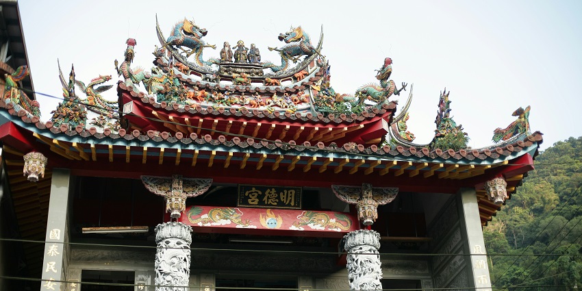 Entrance to Pak Tai Temple featuring traditional design and vibrant details, one of the temples in Hong Kong.