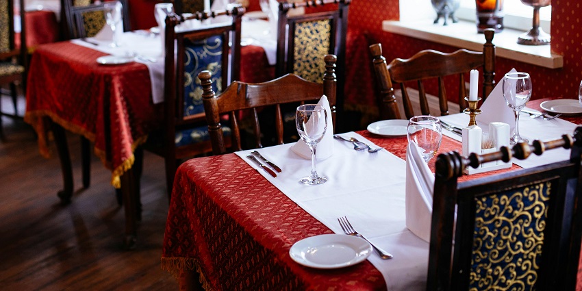 Fine dining setup at Park Restaurant with elegant tables and chairs.
