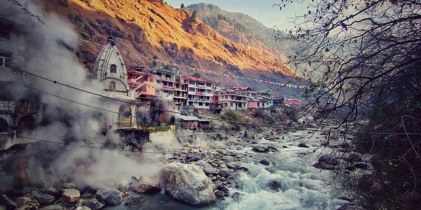 View of Parvati Valley from Ratocha village showing forested hillsides and high peaks.
