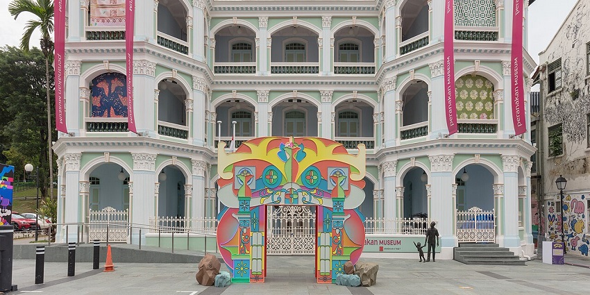 Peranakan Museum Singapore, featuring a pastel green colonial-style building front, one of the stunning museums in Singapore.
