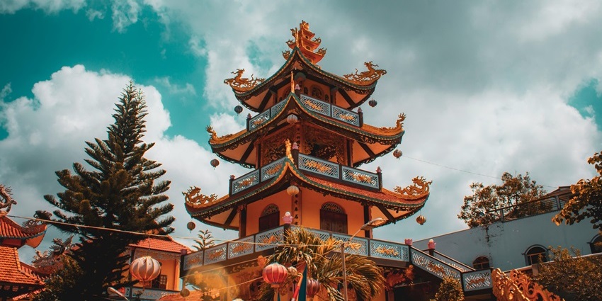 Perfume Pagoda in Vietnam with limestone hills, cave temples, and lush greenery.