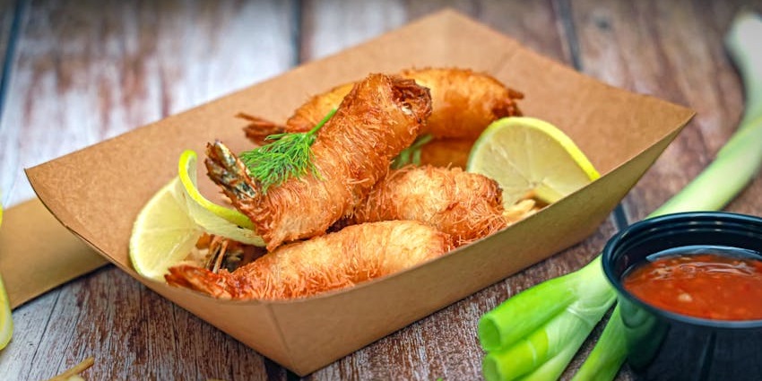 Fried fish served on a plate at a restaurant, ready to be enjoyed.