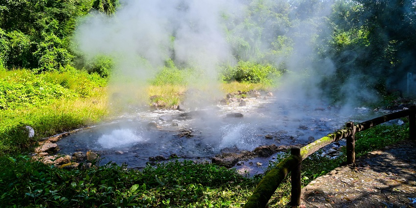 Steaming pools and natural surroundings at Pong Dueat Hot Springs in Thailand.