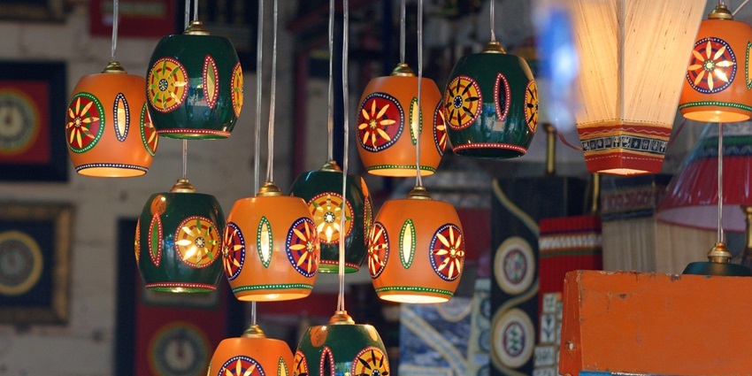 Beautiful, vibrant coloured lamps hanging at Delhi Haat, capturing festive energy.