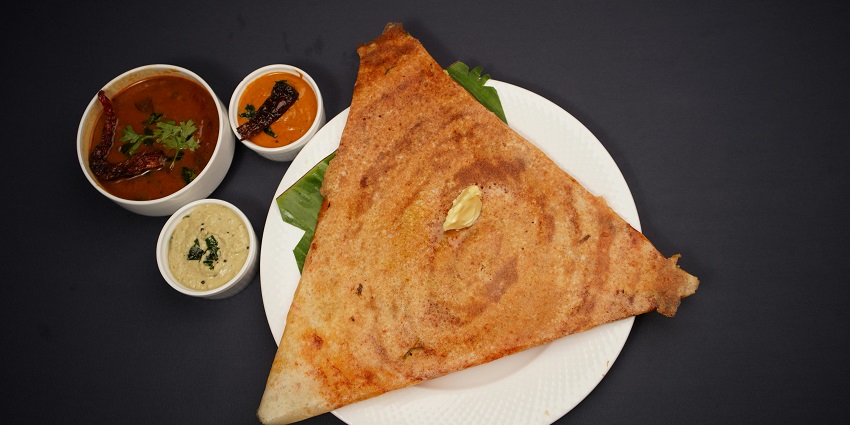 A South Indian thali with dosa and sambar and two types of chutneys is served, one of the best pure veg restaurants in Gangtok.