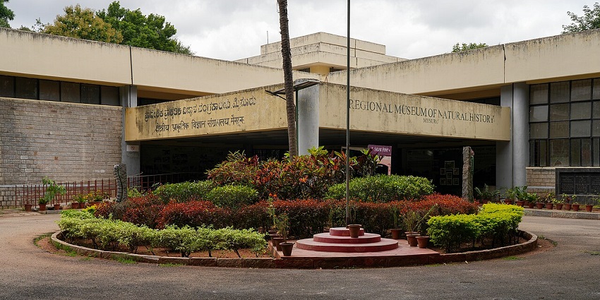 Entrance view of the Regional Museum of Natural History in Mysuru with garden landscape.