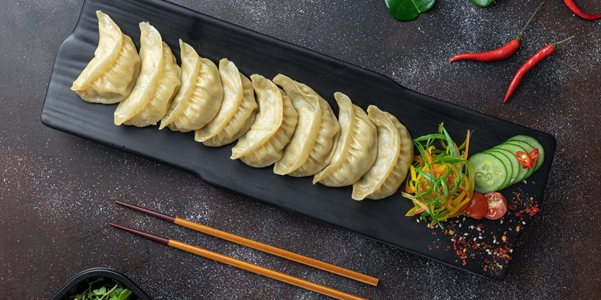 Steamed momos served on a plate at the best non-veg restaurants in Guwahati.