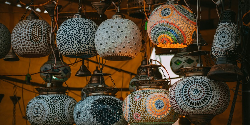 Colorful lampshades hanging outside a shop at SM Street, a vibrant spot for shopping in Kerala.
