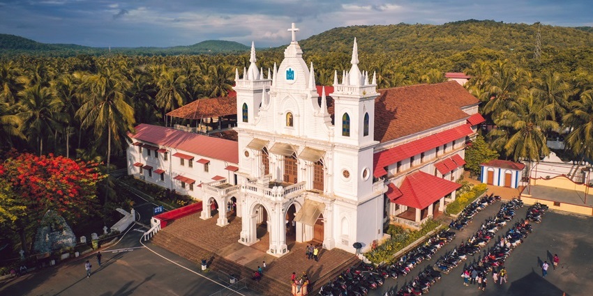 Aerial view of St. Anthony Church in Siolim, showcasing its architecture and surrounding landscape.