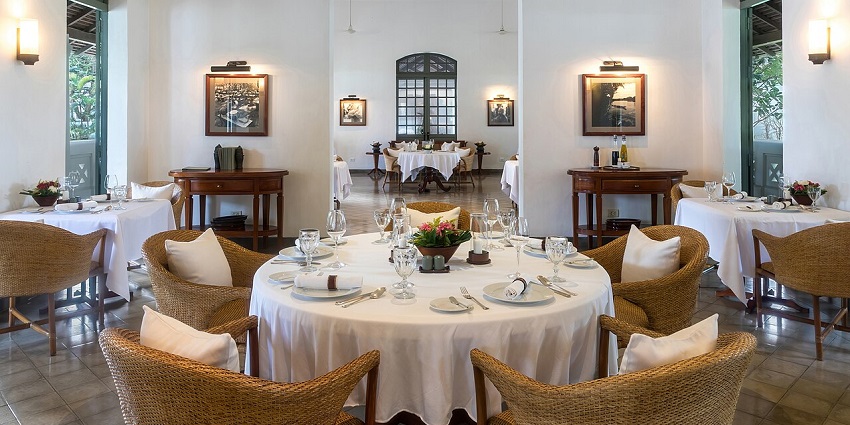 Dining area of a luxury restaurant with clean and well-designed interiors at one of the vegetarian restaurants in Havelock Island.