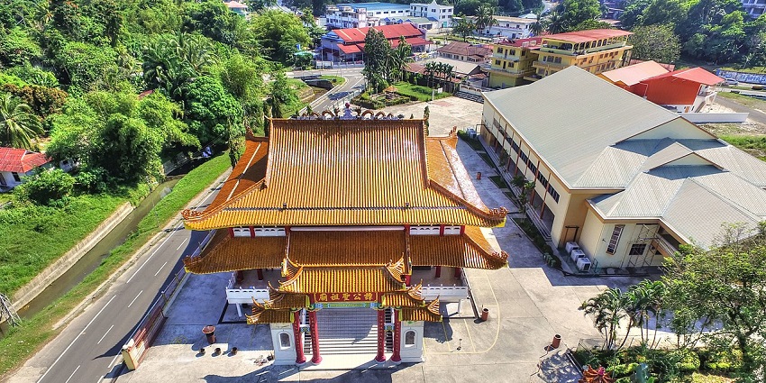 Aerial view of Tam Kung Temple showing traditional rooftops and the surrounding landscape.