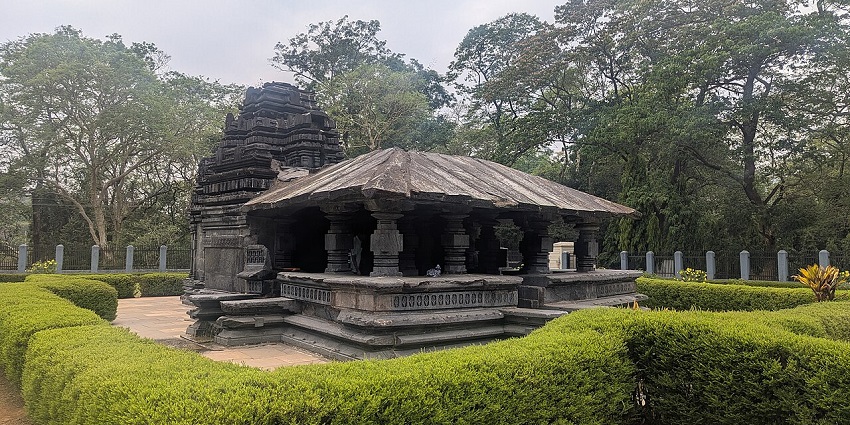 Tambdi Surla Mahadev Temple with black stone traditional architecture and detailed carving.
