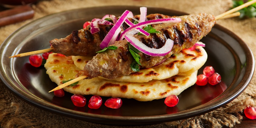 Seasoned skewered minced-meat sausages grilled to perfection at the best non-veg restaurants in Guwahati.