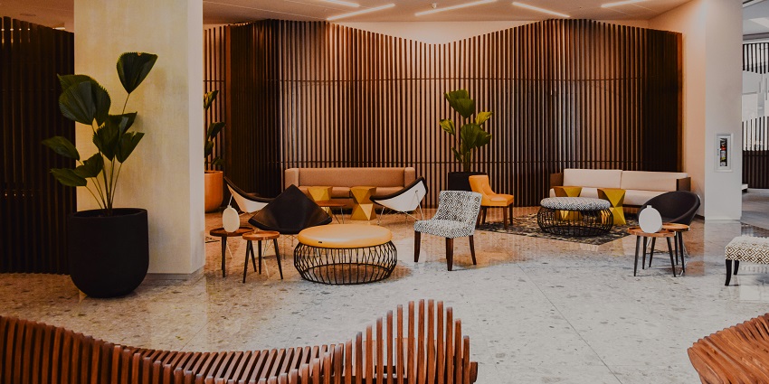 Elegant hotel lobby at The Lalit Ashok, High Grounds, with modern interior décor.
