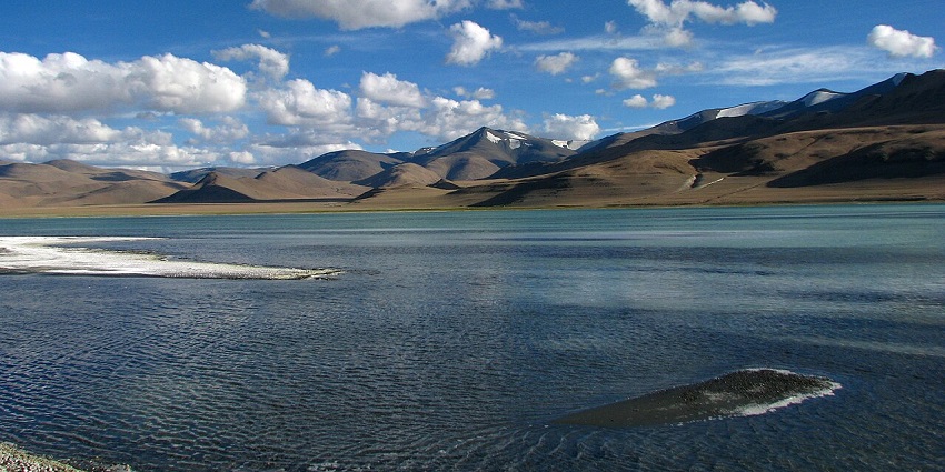 Salty Tso Kar lake reflecting the sky in the scenic Tso Kar Basin wildlife sanctuary in Ladakh.
