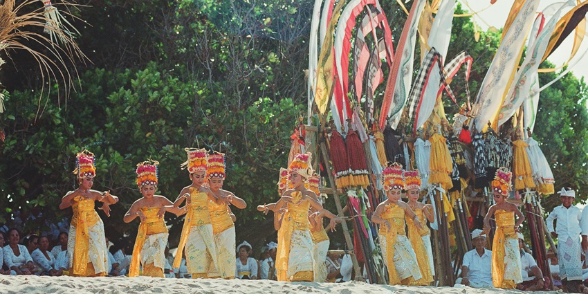 Balinese dancer performing during Tumpek Landep ceremony at festivals in Bali.