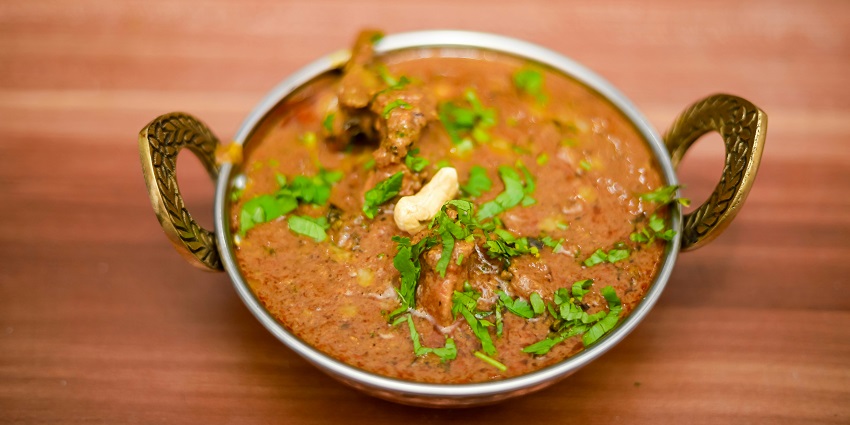 Chicken curry served in a bowl at a South Indian restaurant.