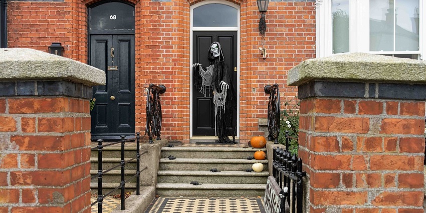 A horror statue is kept in front of a house’s door during the Halloween celebrations, similar to what's expected in Halloween day 2025.