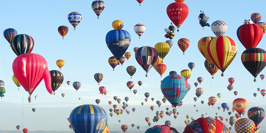 Hundreds of hot air balloons being released at the mass ascension of Albuquerque balloon festival.