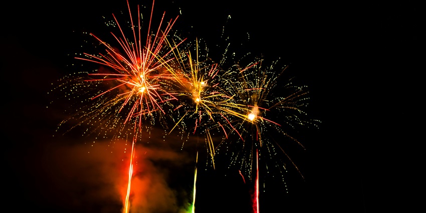 Fireworks burst in the night sky, celebrating the festival of Diwali in Ayodhya.