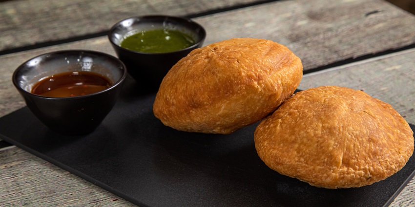 Hot kachori served on a plate, ready to eat.