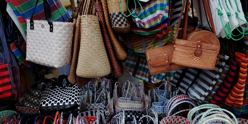 Handcrafted bags on display at the Women's Alliance of Ladakh, showcasing shopping in Ladakh.
