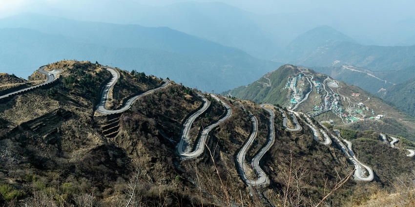 Zig-zag roads leading to the small settlement town Zuluk surrounded by mountains.
