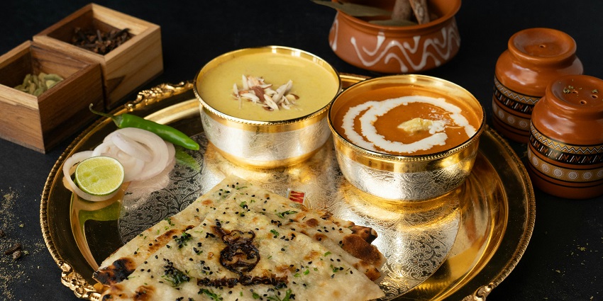 Indian thali with dal and naan at Bajwi Hotel, one of the famous restaurants in Six Mile Guwahati.
