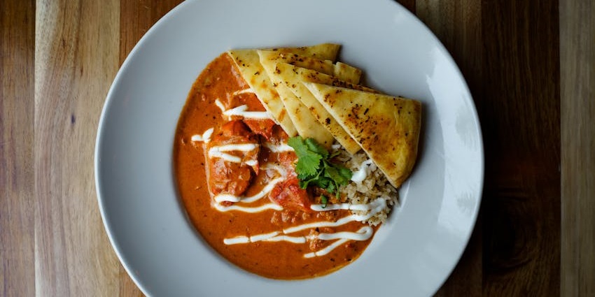 Butter chicken with flatbread served at Bombay Brasserie, one of the popular restaurants on GS Road Guwahati.