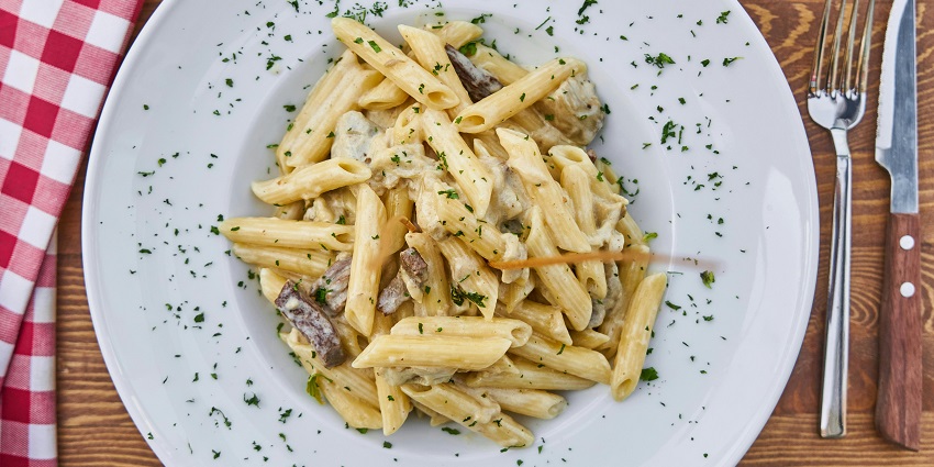 White sauce creamy pasta served at Botanee, a must-try dish at restaurants in Ulubari Guwahati.