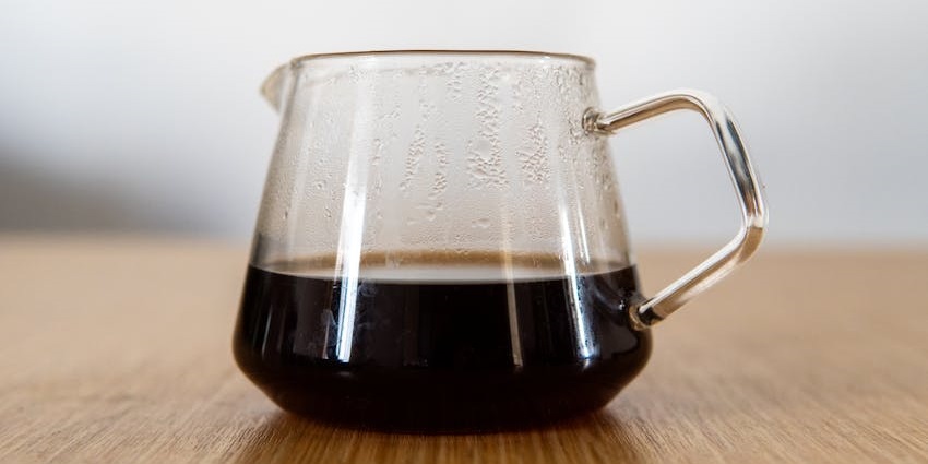 Glass carafe with freshly brewed coffee at Chennai Kitchen, one of the veg restaurants in Guwahati.