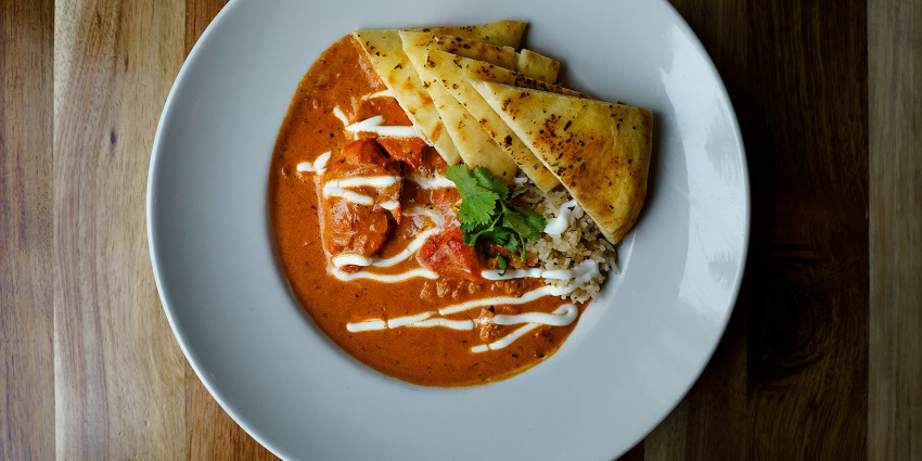 Butter chicken with naan served at CJ’s Fine Dining Restaurant, one of the famous restaurants in Pasighat.
