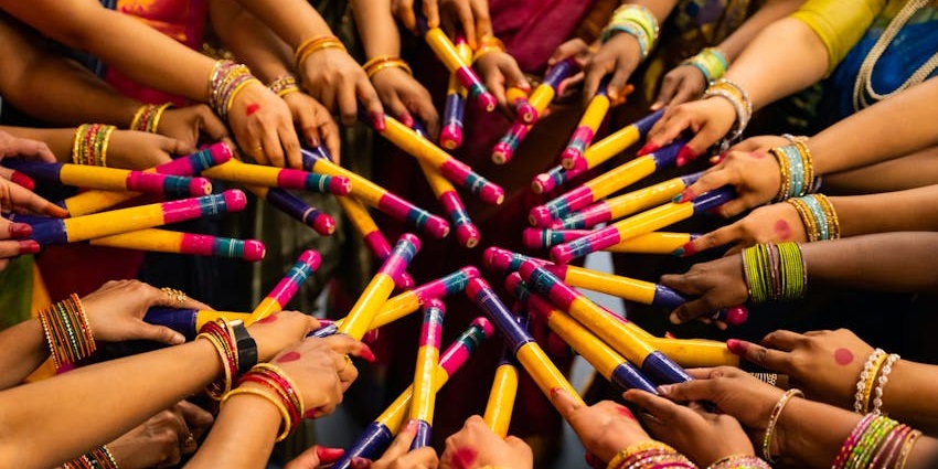 People with Dandiya Sticks Celebrating the festival - one of the popular Gujarathi dance