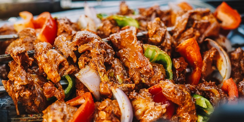 Close-up of Chicken Tikka on a serving tray at Divine Dining, one of the top restaurants in Jorhat.
