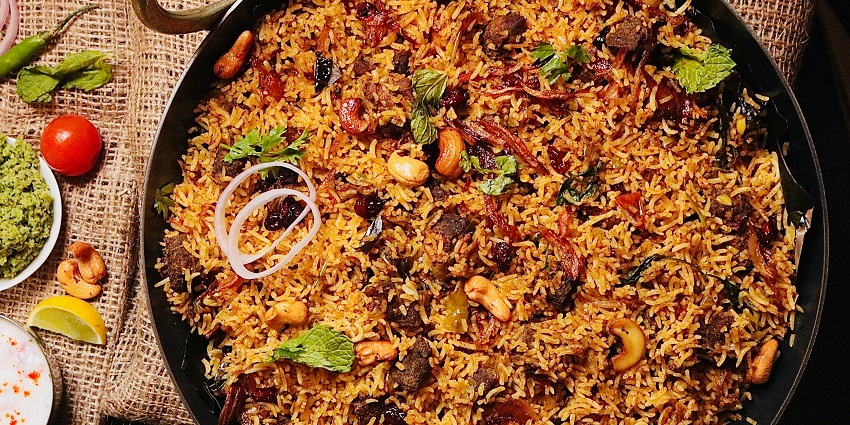 Veg biryani served at Extra Butter Pure Veg Restaurant in a traditional style.
