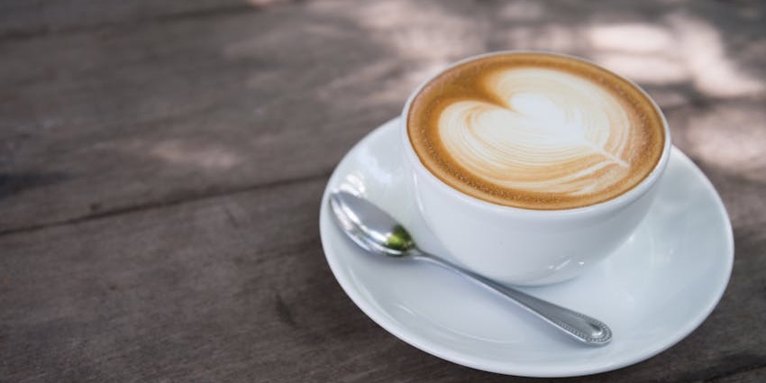 Cappuccino with latte art served at Glenary’s Bakery & Café, one of the top cafes in Darjeeling.