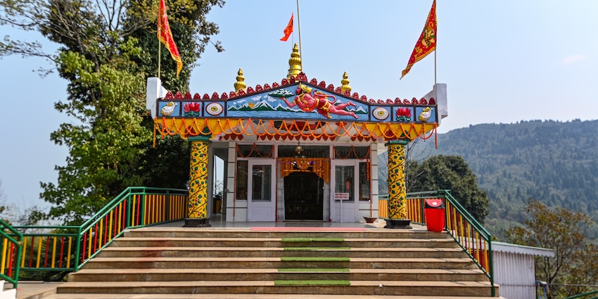 Colourful Hanuman Tok Temple in Gangtok with bright flags and scenic Himalayan backdrop